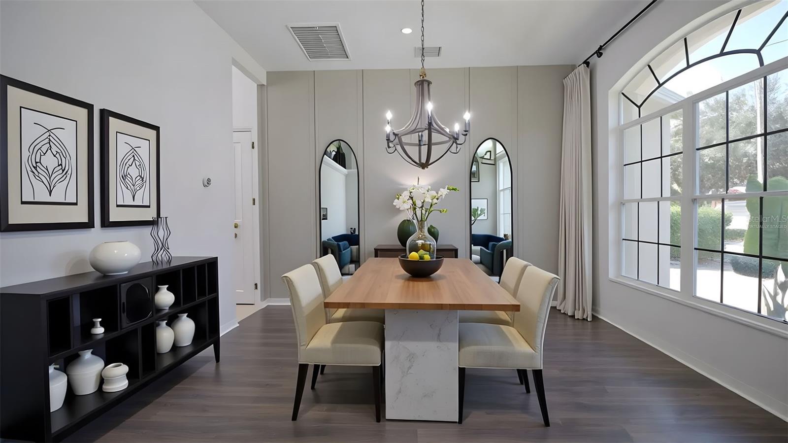 Virtually staged dining room with custom millwork feature wall