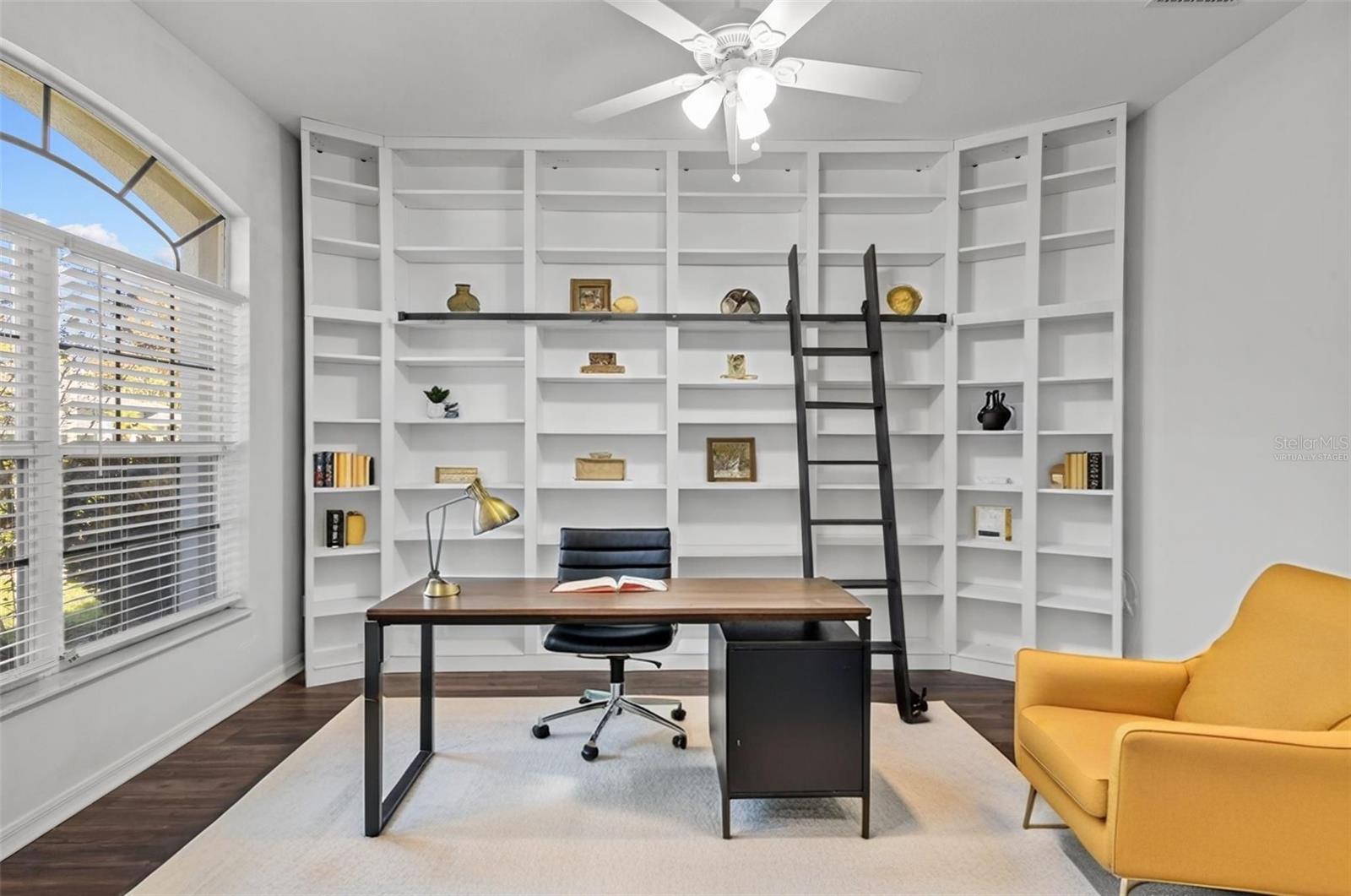 Virtually staged office with built-in shelving