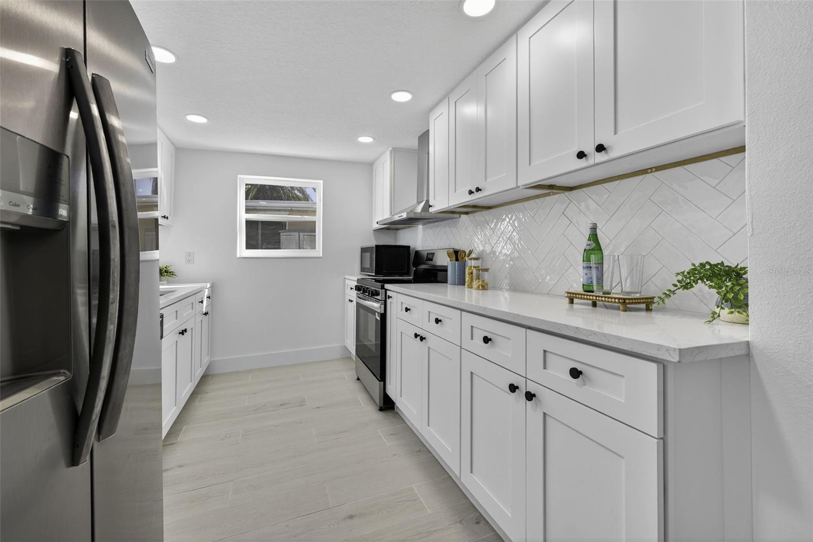 Brand New Kitchen with Stone Countertops and New Cabinetry