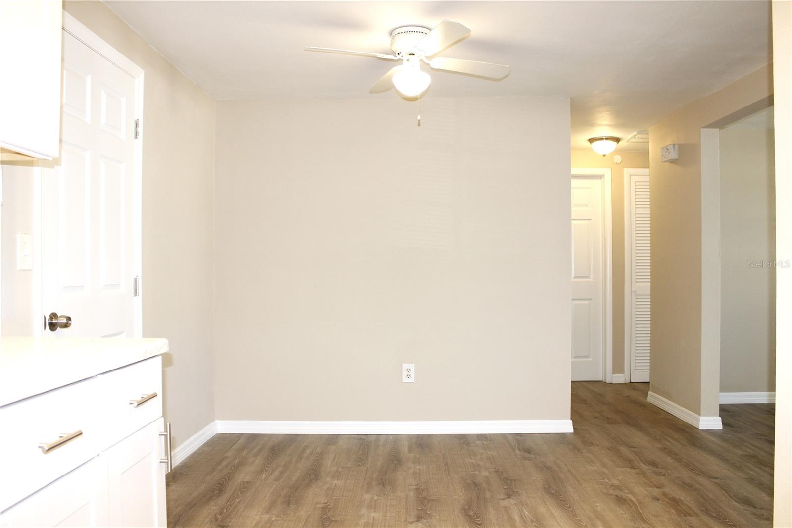 VIEW FORM KITCHEN TO DINING ROOM AND HALL TO BEDROOMS