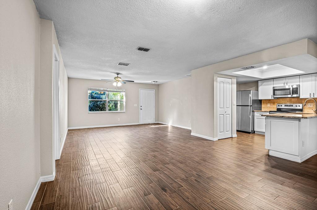 Open concept living and dining into kitchen
