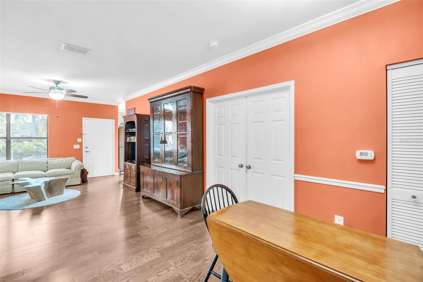 FRENCH DOORS LEADING TO PRIMARY BEDROOM