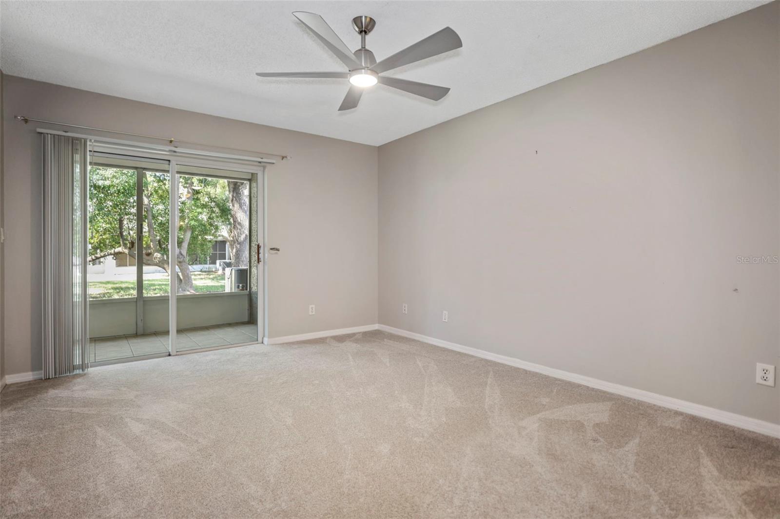 Primary bedroom with sliders to lanai