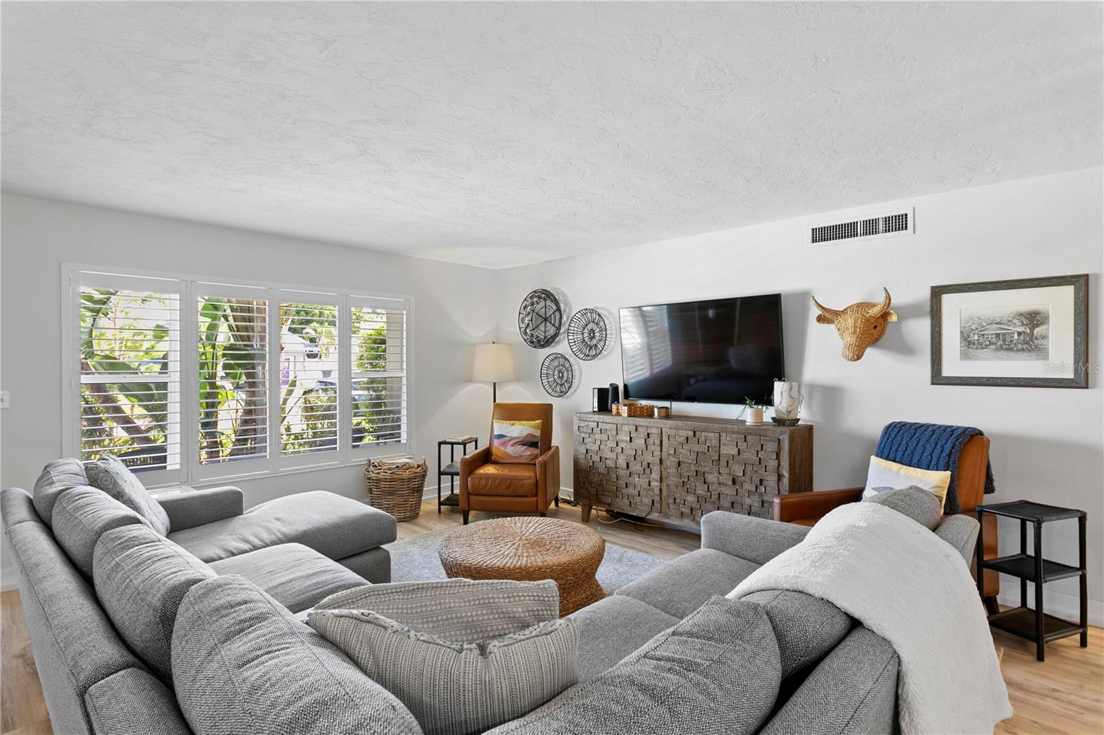 Abundant natural light and stylish plantation shutters that enhance both comfort and style!