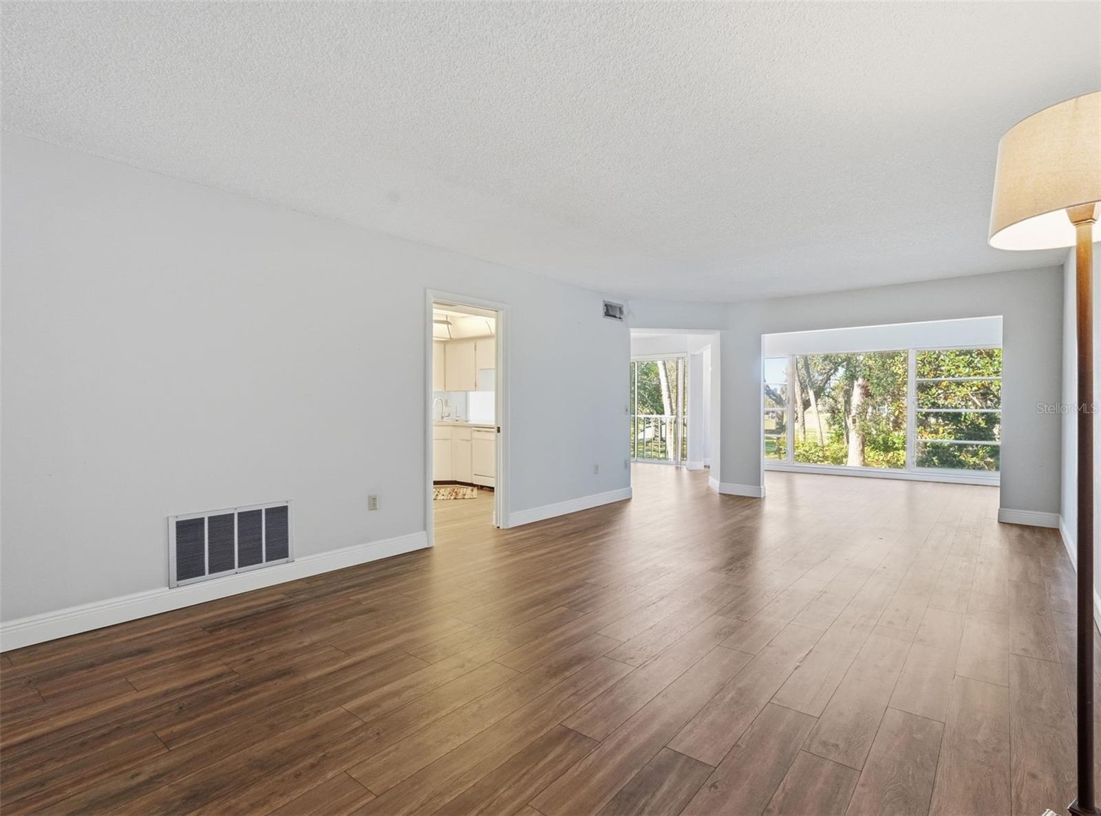 Living Area with Bonus Area overlooking the lush greenscape