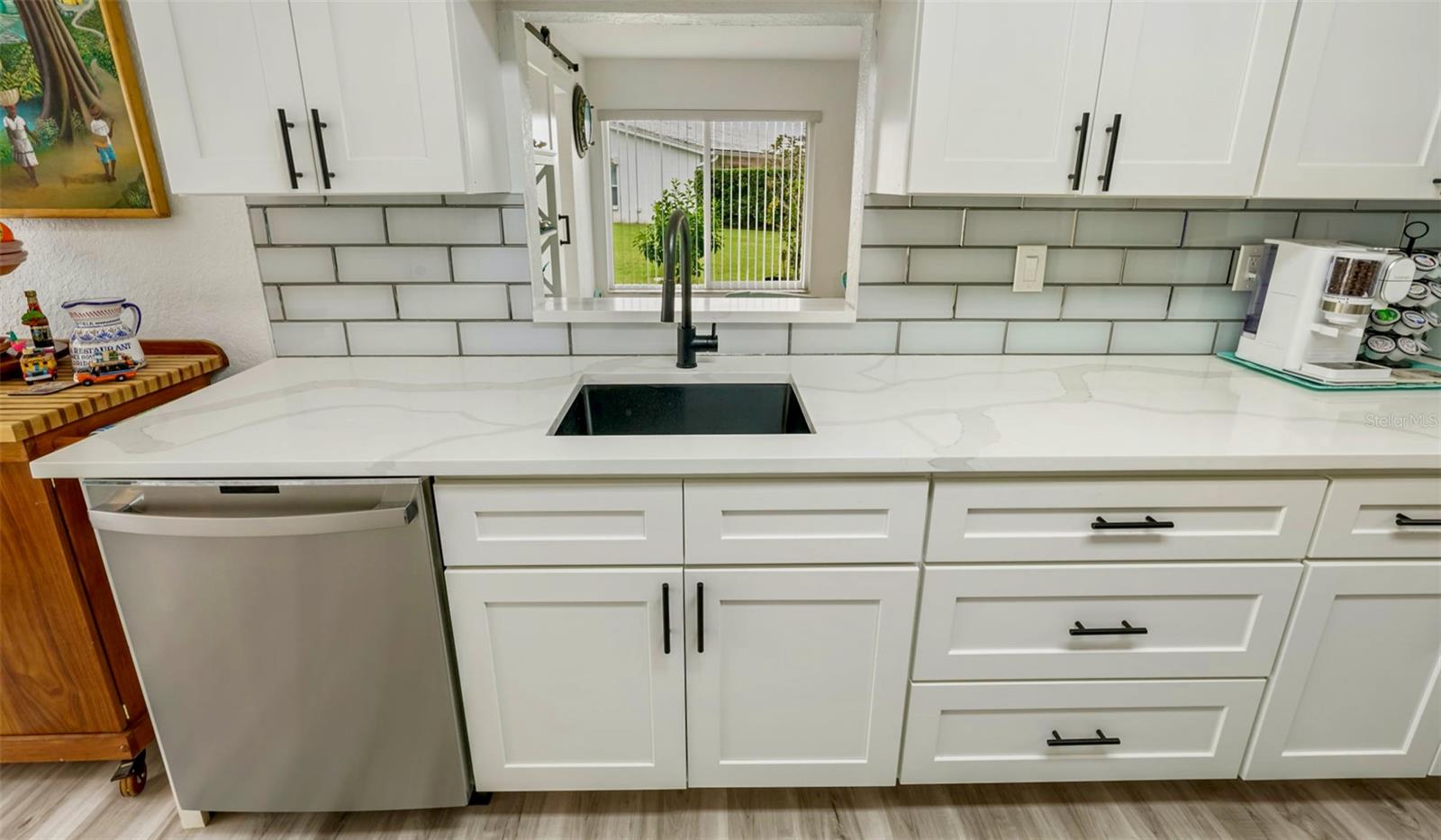 11-Kitchen sink view through pass thru to family room