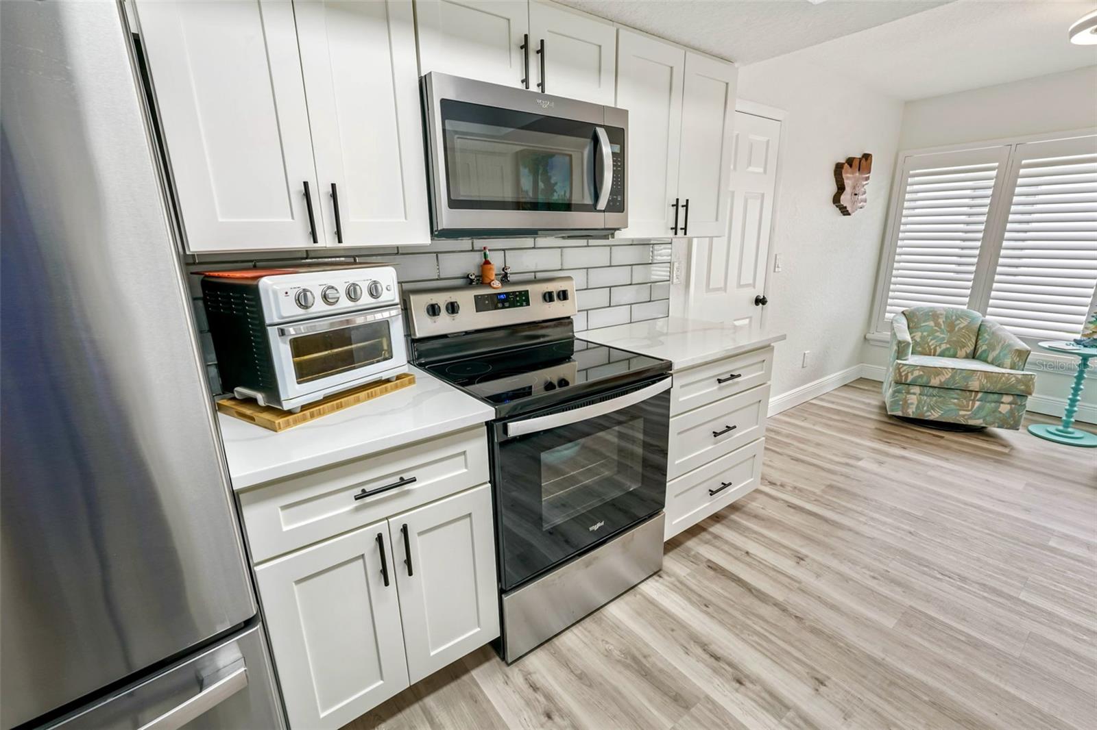 12-Kitchen range side with door to garage