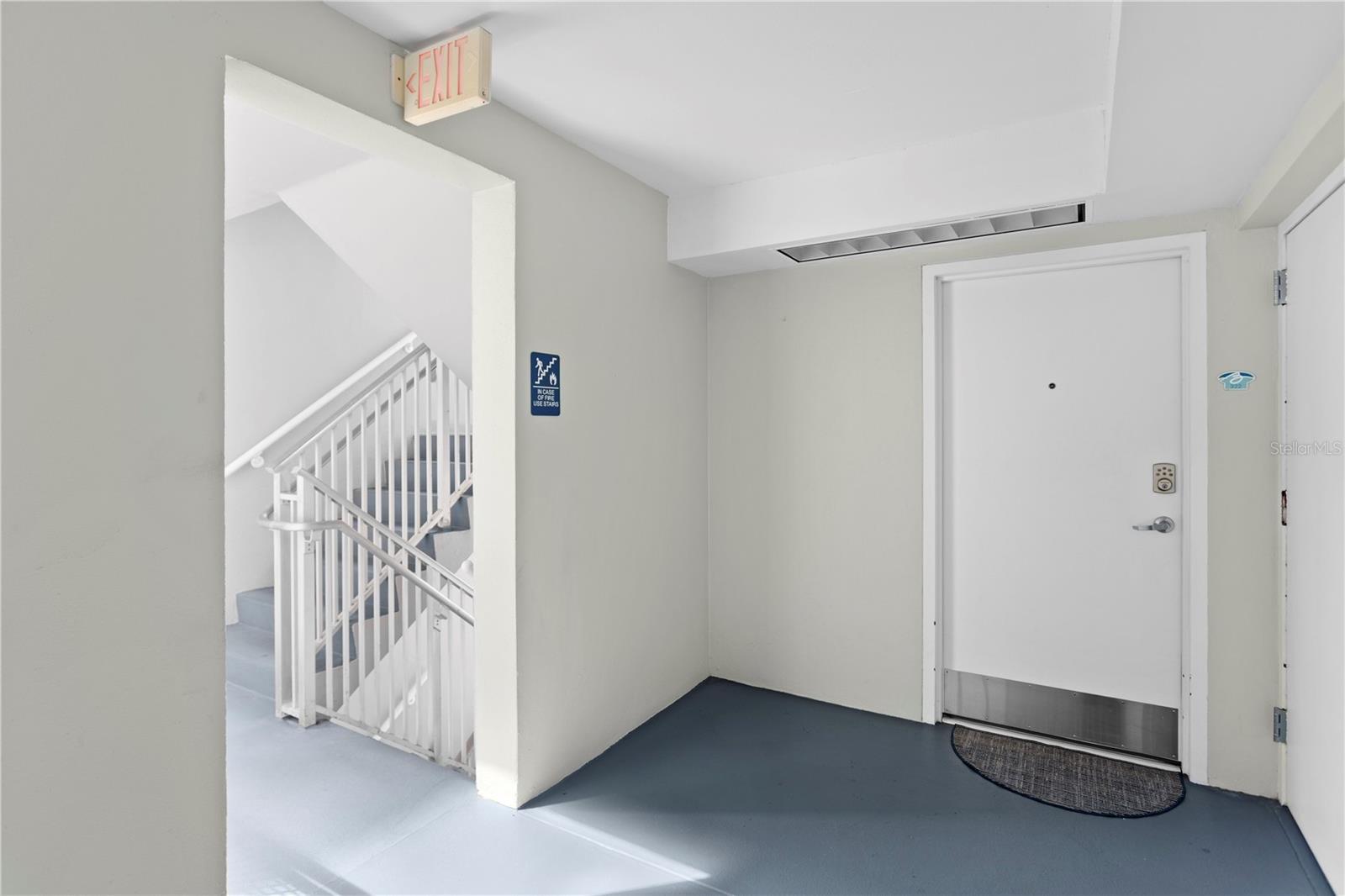 Entrance to corner unit- next to stairs