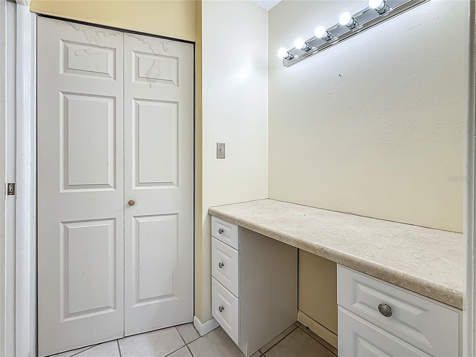 Vanity in Primary Bedroom Outside of Walk-In Closet