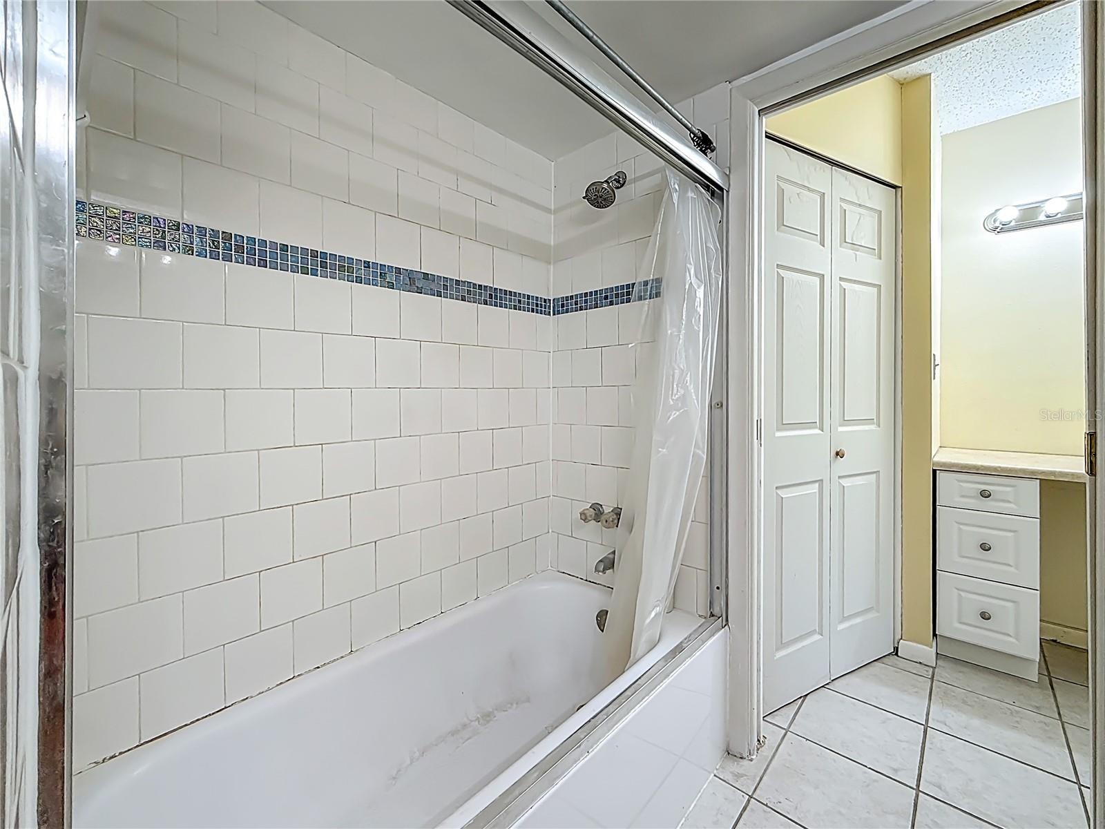 Tub and Glass shower screen.