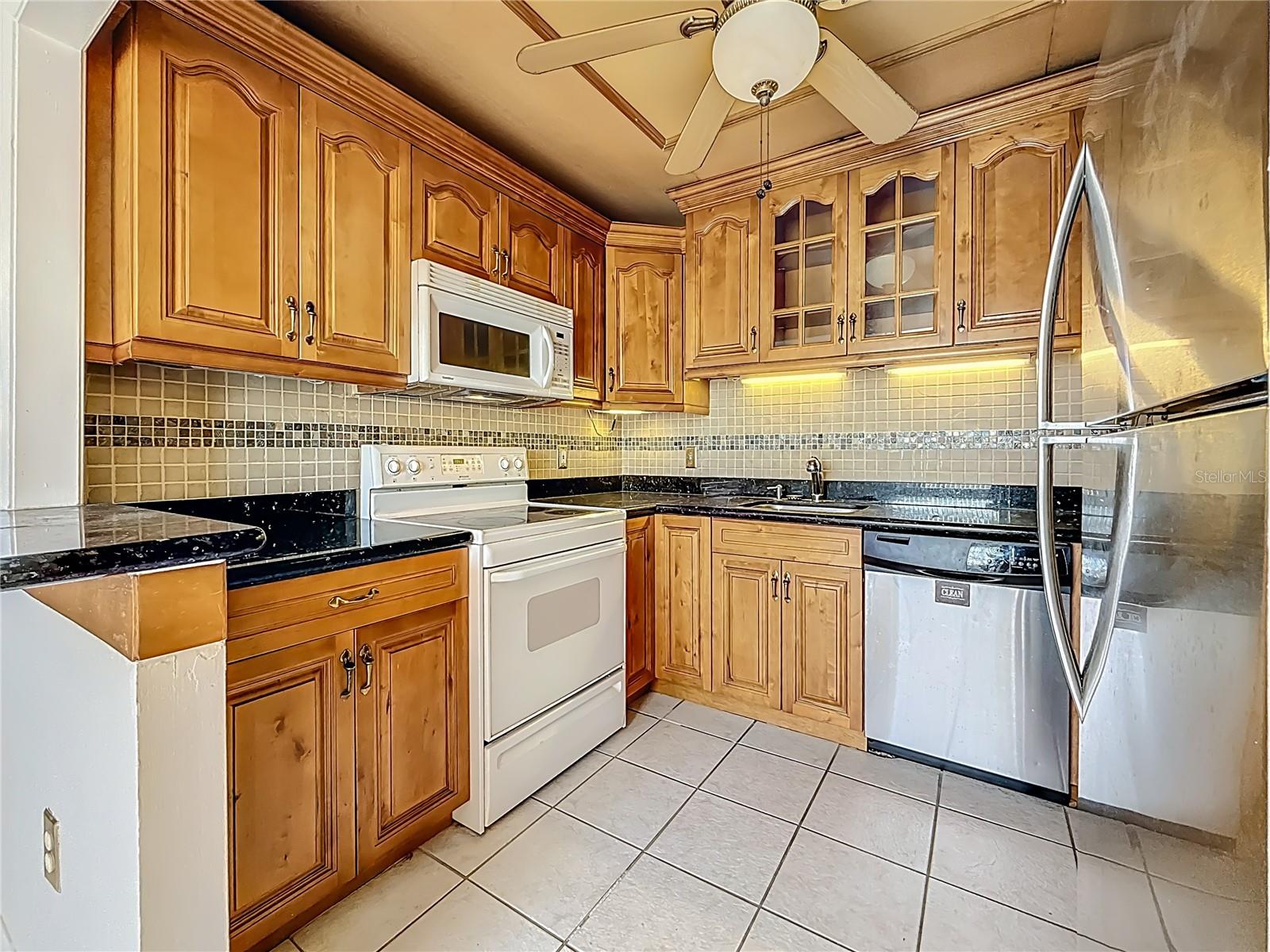 Large Kitchen with Granite Counters and Solid Cherry Wood Doors