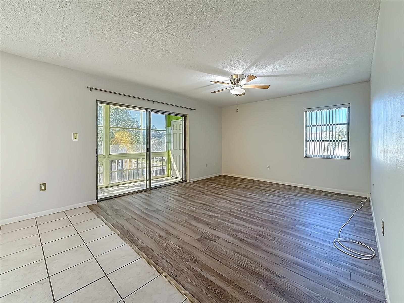 Living Room Leads to Screened in Patio