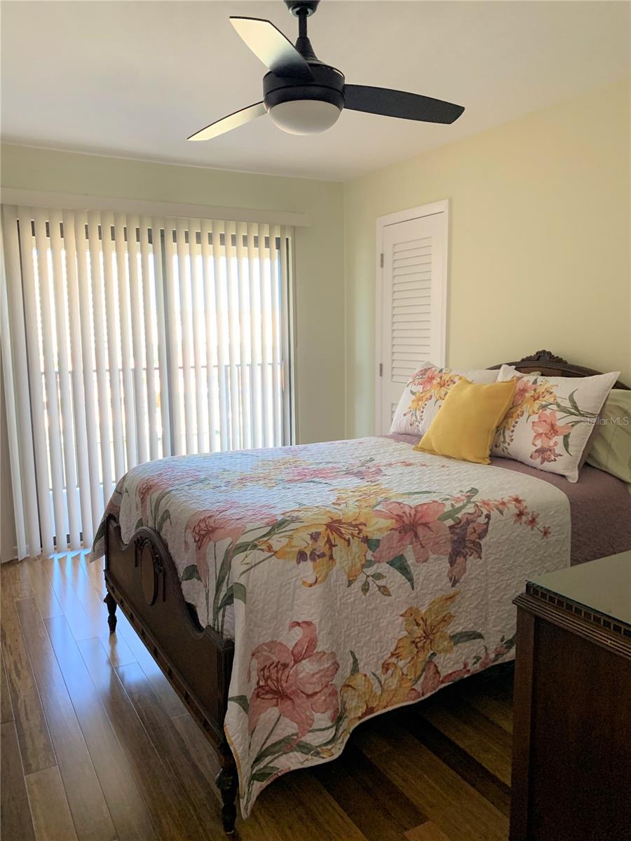 Bedroom # 2 glass sliding doors to patio & view to water