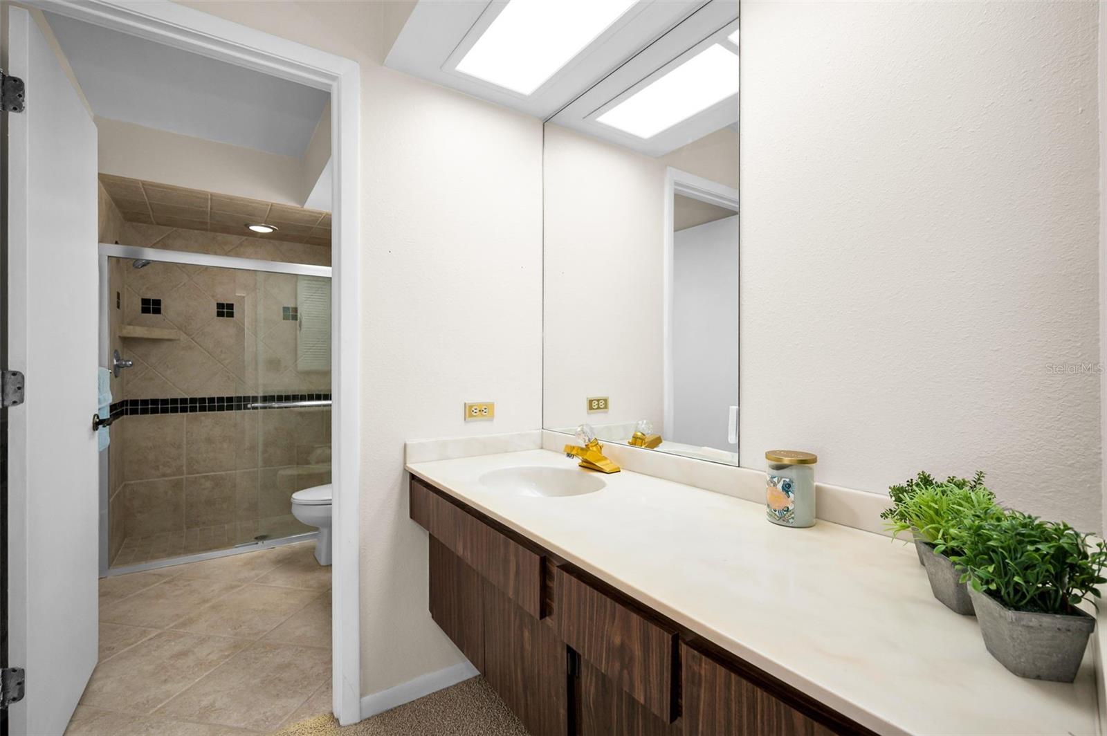 Sink and dressing area in primary suite