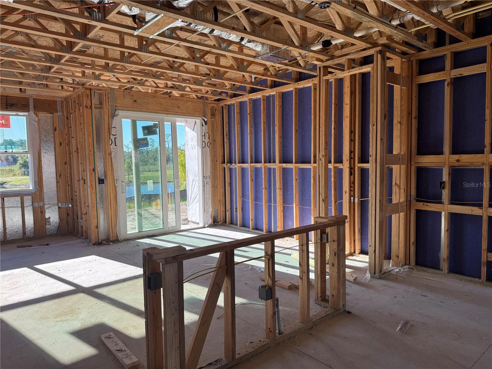 Kitchen with large central kitchen island & Dining Room