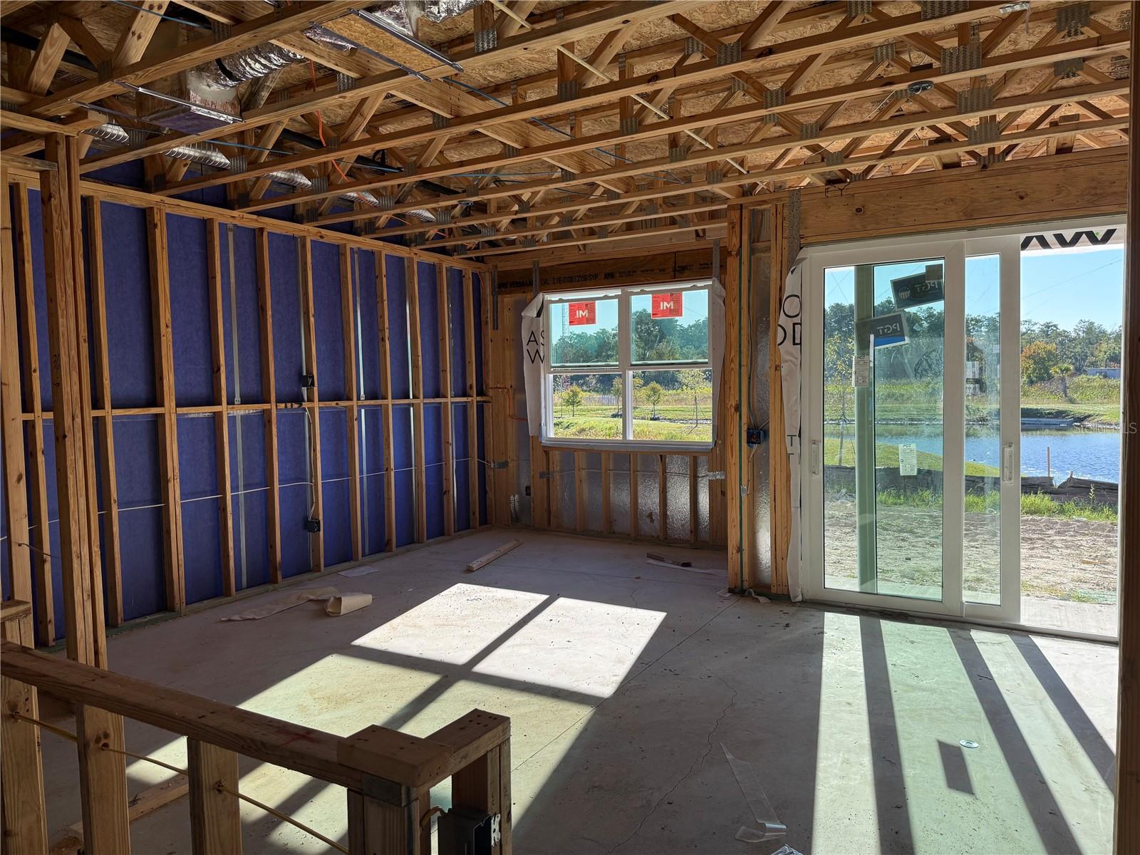 Open Living Room & Dining Room with patio access