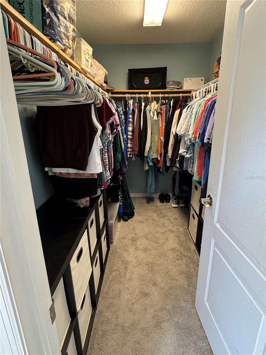 Primary Bedroom Walk-In closet with plenty of storage