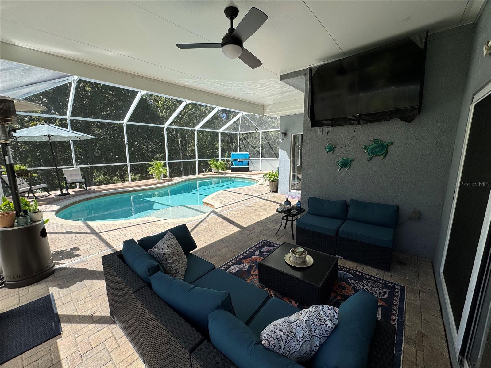 Covered lanai was extended to provide some shade. Great place to watch the game, TV stays.