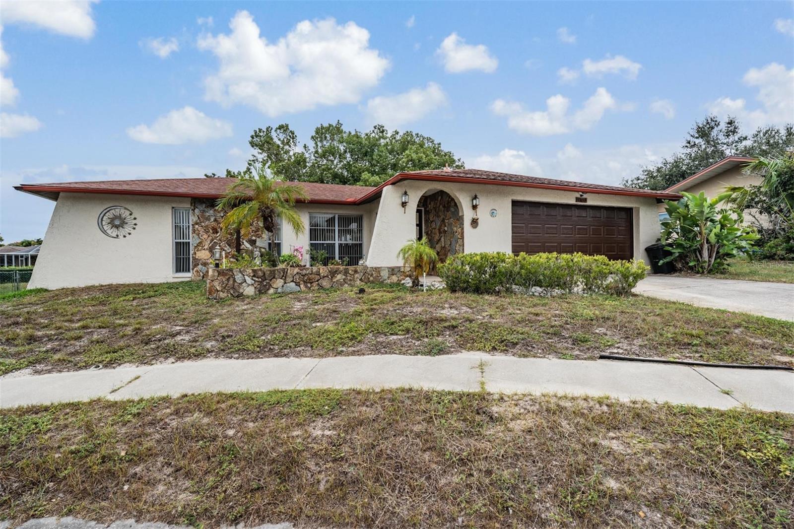 7032 Fernleaf Court, Port Richey on cul-de-sac. Mature landscape.  Roof is 7 years old.