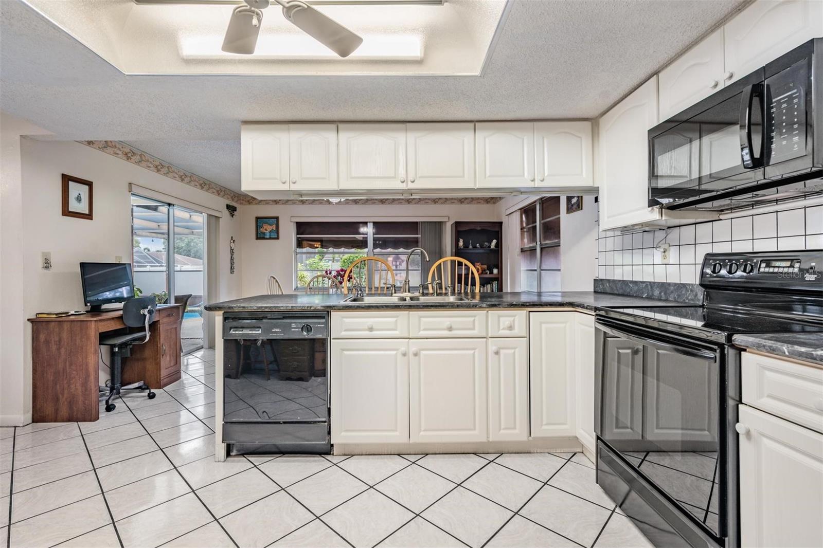 Open bright kitchen with eating area