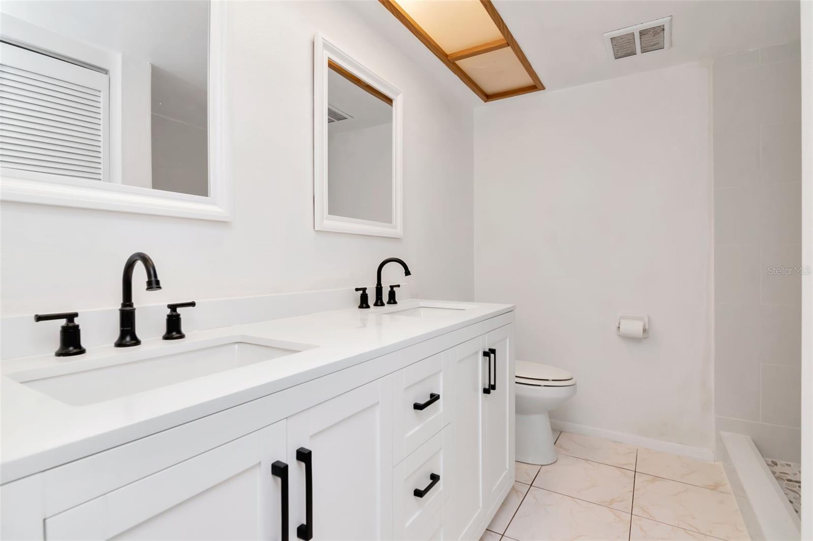 New vanity with quartz countertops