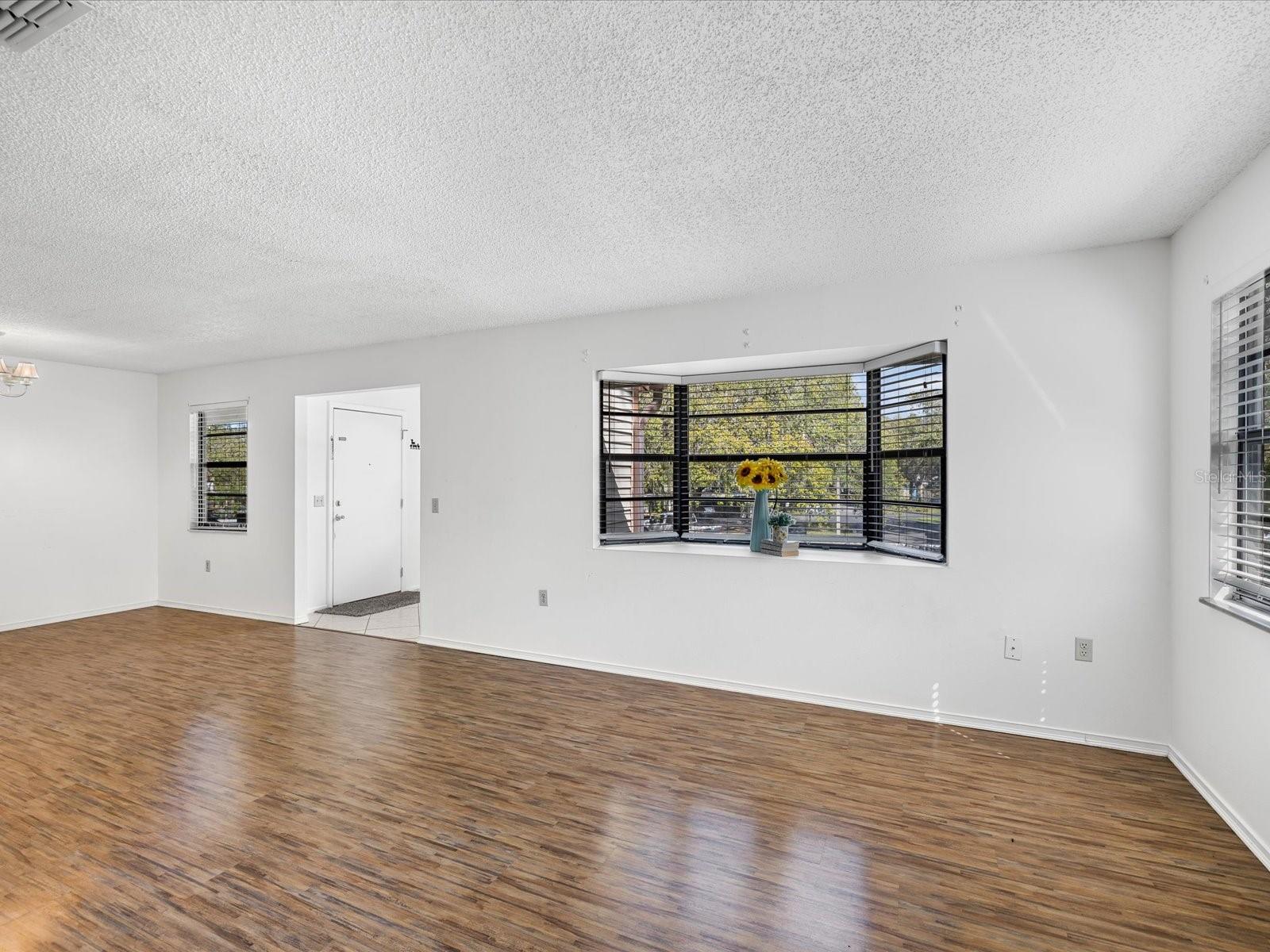 Living room, dining open floor space. Large bay window