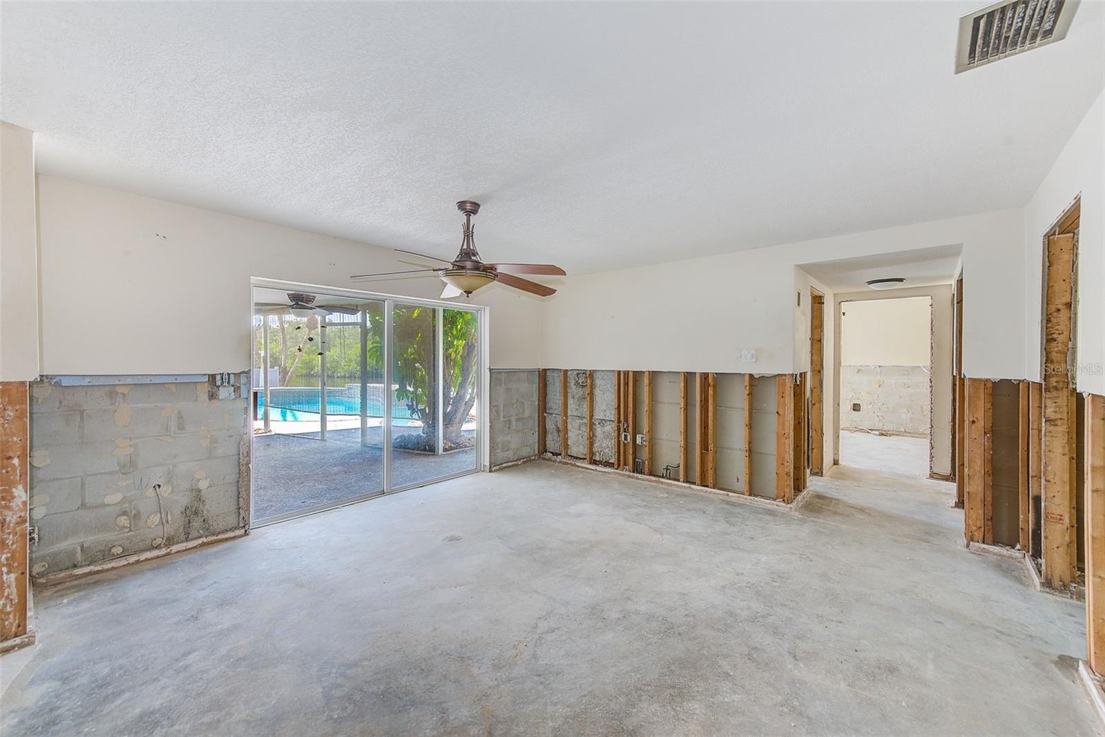 Family Room with sliders to pool and backyard