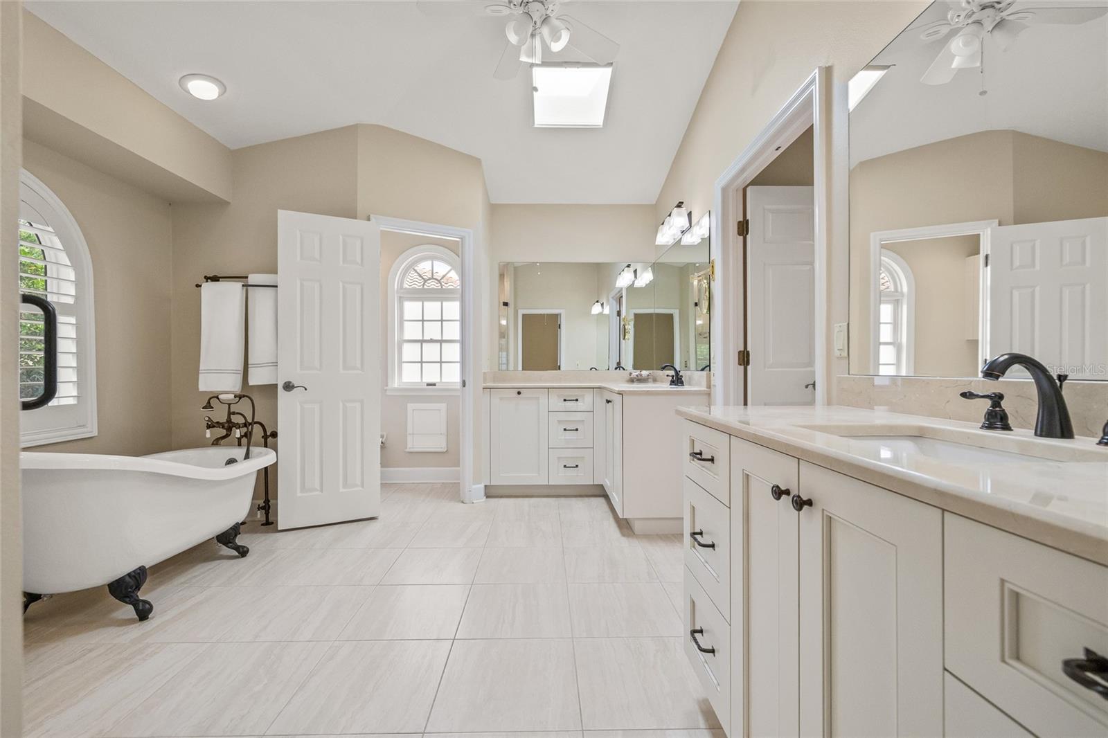 Separate commode with privacy door.