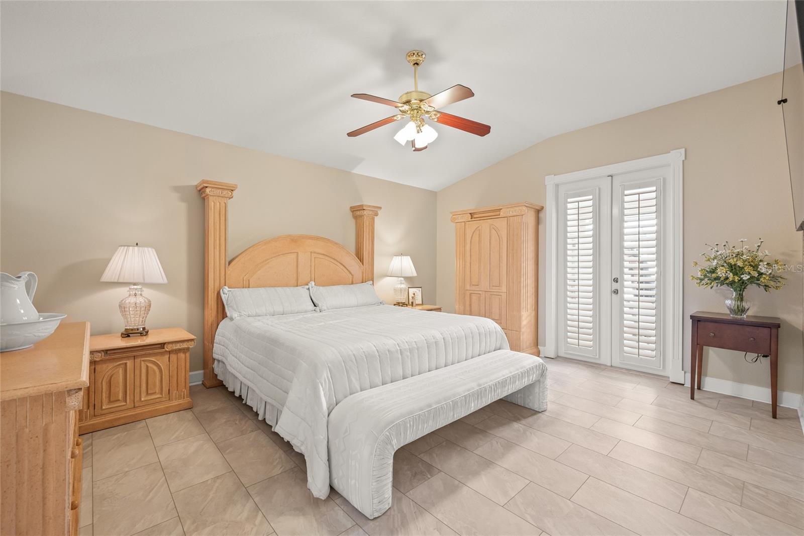 Primary bedroom has French doors that lead to your personal access to the pool area.