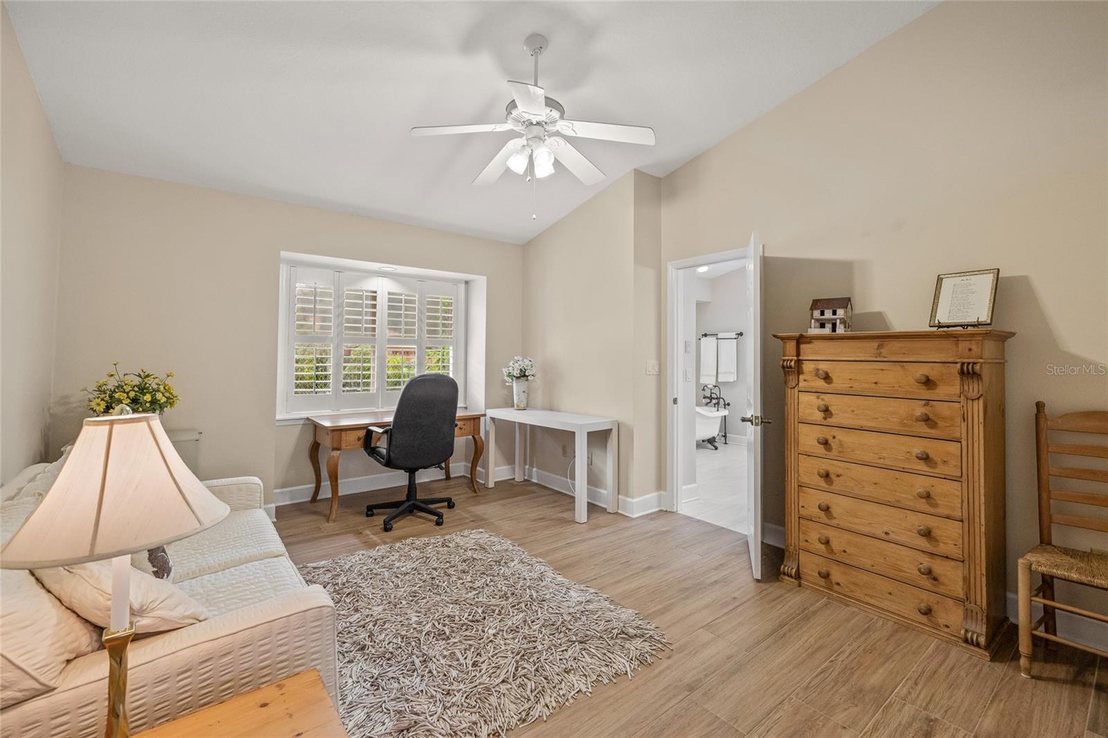 Bedroom 2 is adjacent to the primary bathroom. This room does have a sizeable closet.