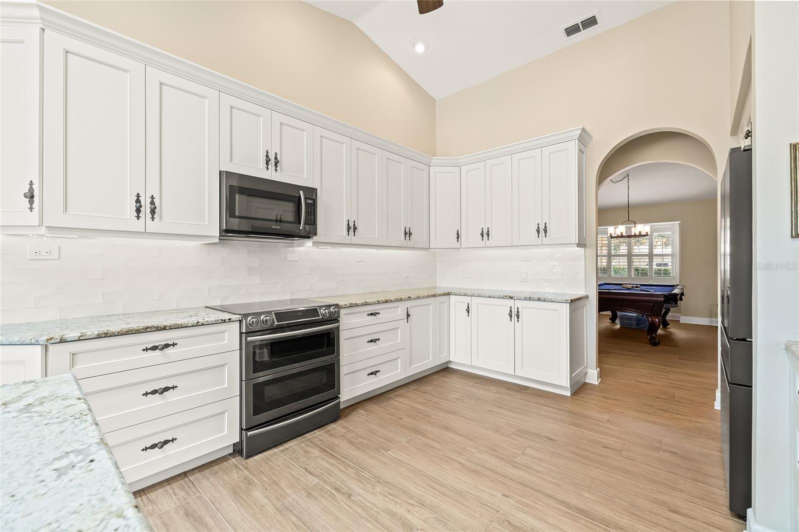 Customized cabinets feature pull out shelving and custom Lazy Susan.
