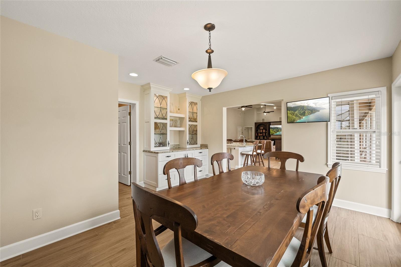 Dining room with built in dry bar off of the kitchen.