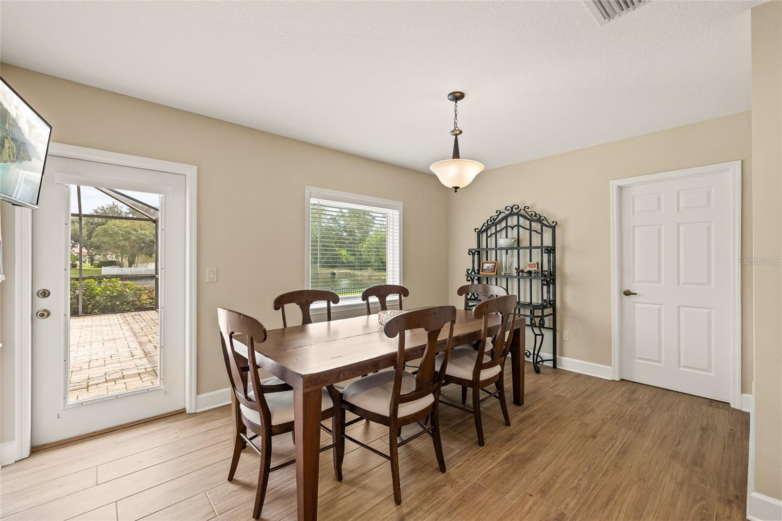 Separate large dining room overlooking the pool and sparkling lake.
