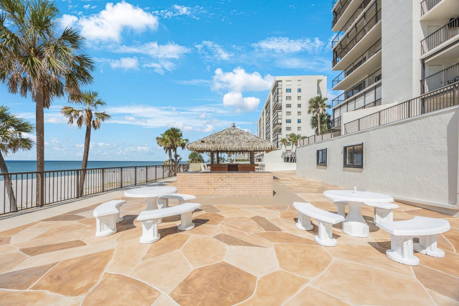 Table by Grill and Tiki Hut