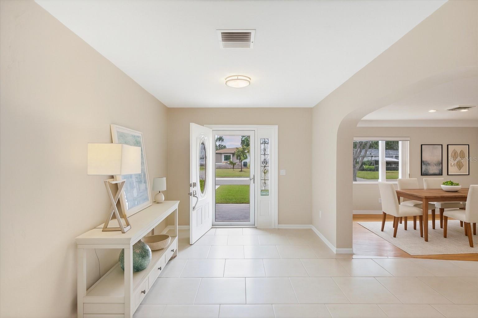 Entryway/Foyer (dining room to the right is digitally staged)