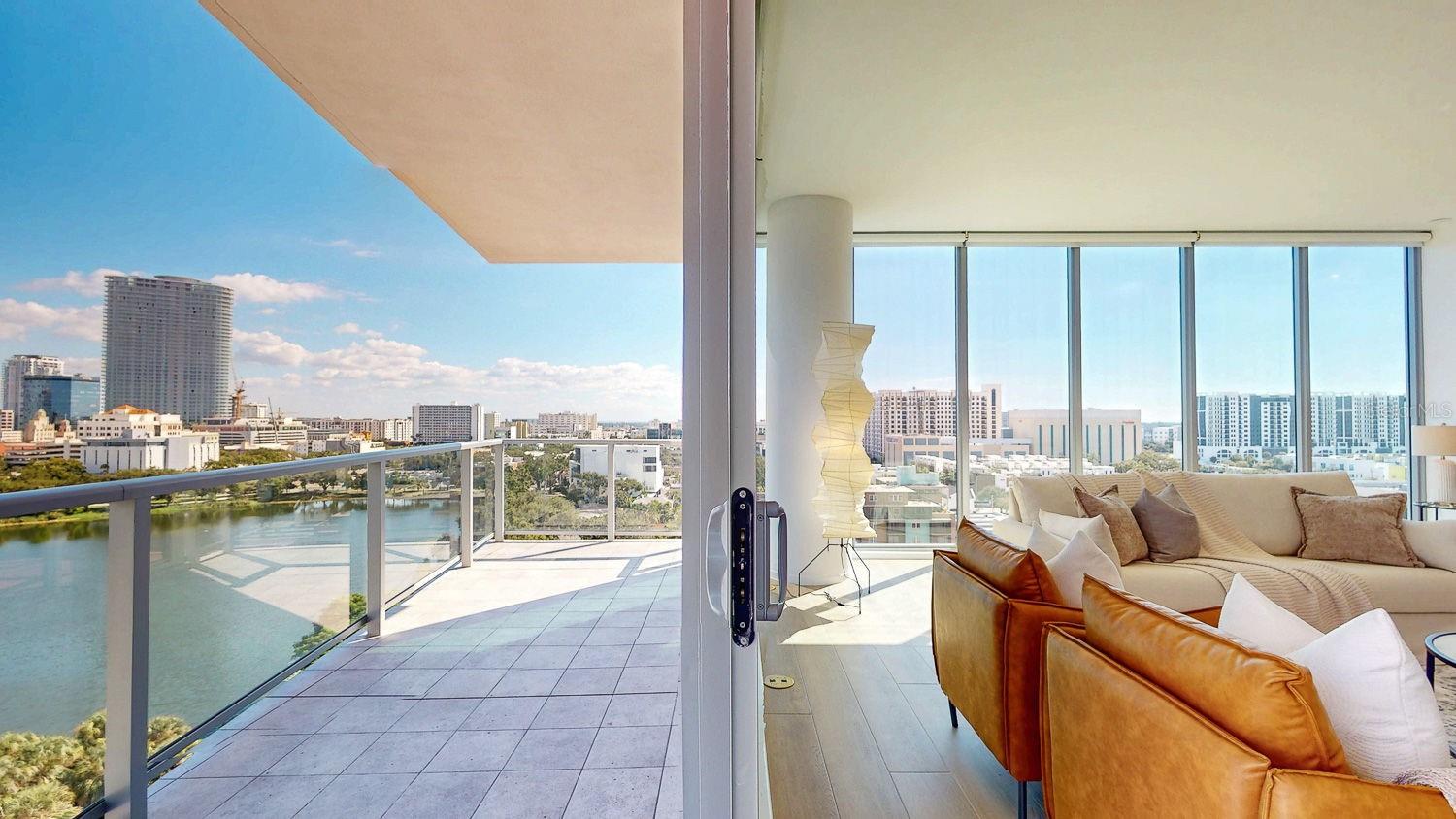Very large covered balcony showing part views of the downtown St Pete !