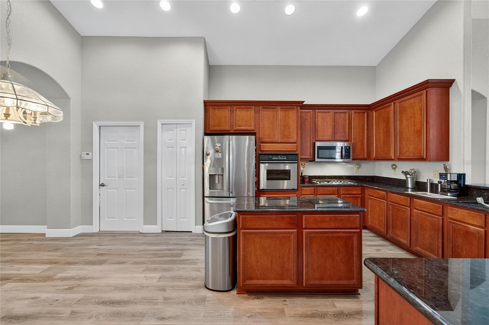 Closet pantry with roll-out custom shelving