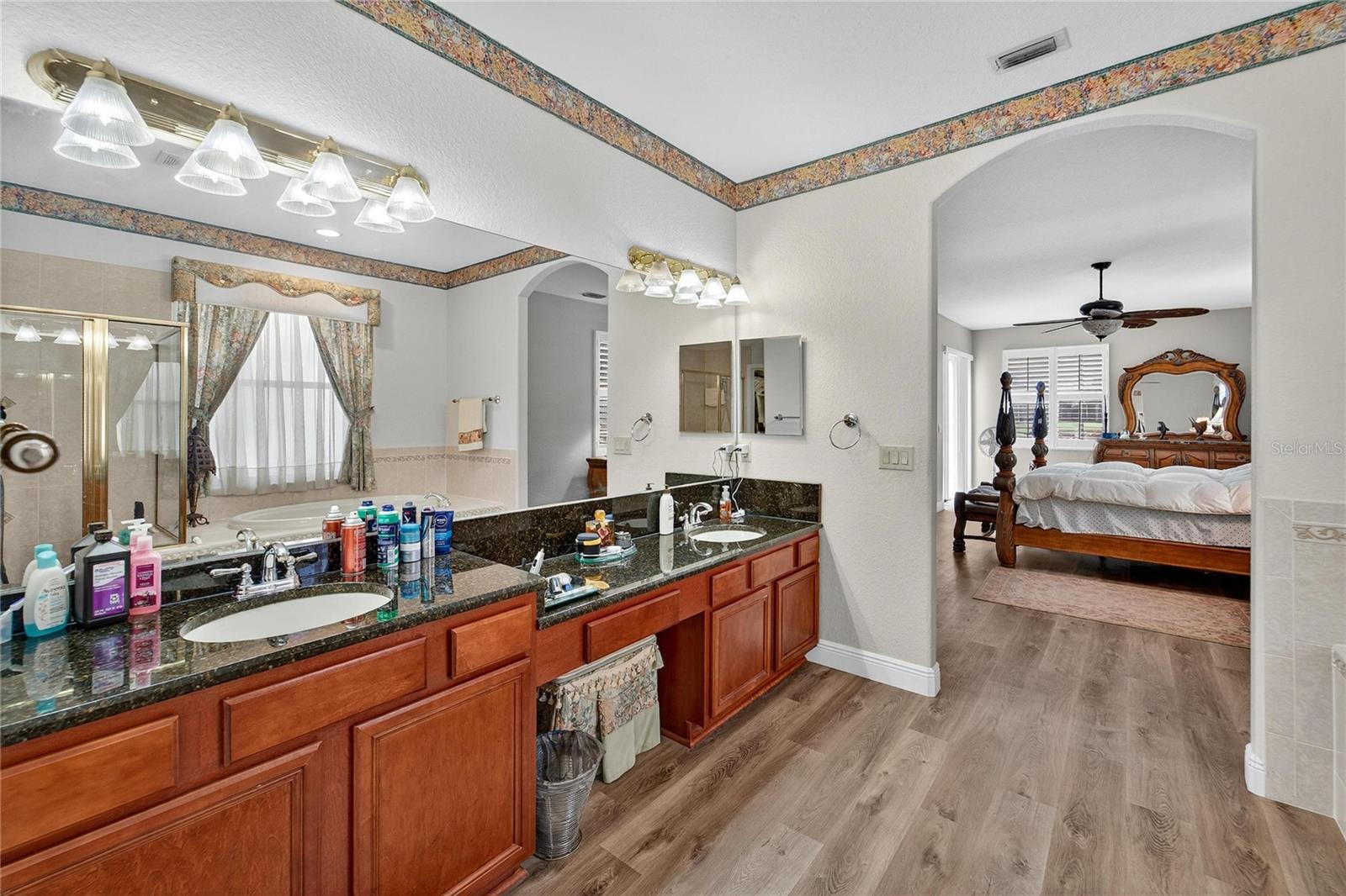 Primary bathroom with dual vanities