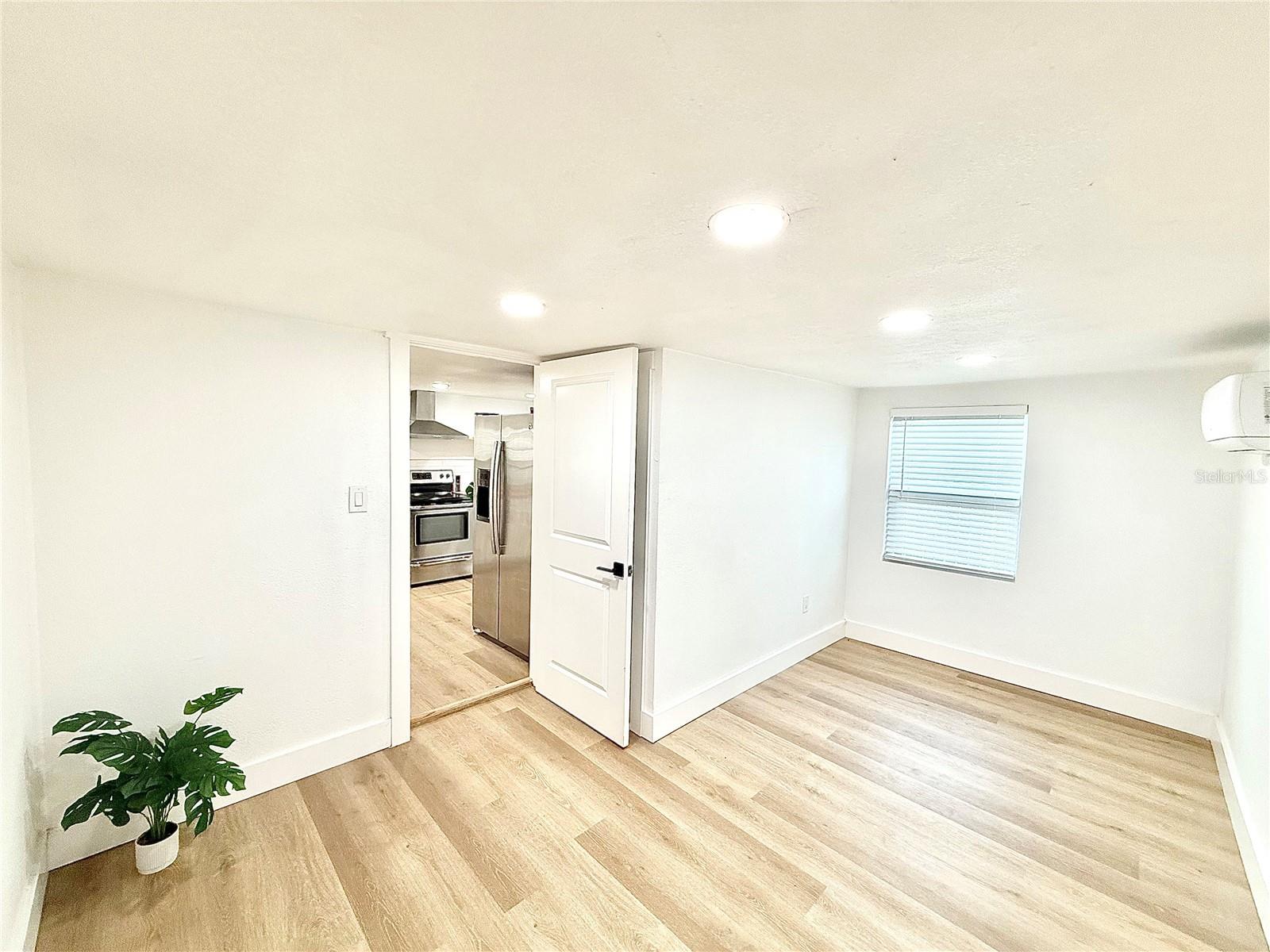 2nd bedroom with private access to the gated backyard