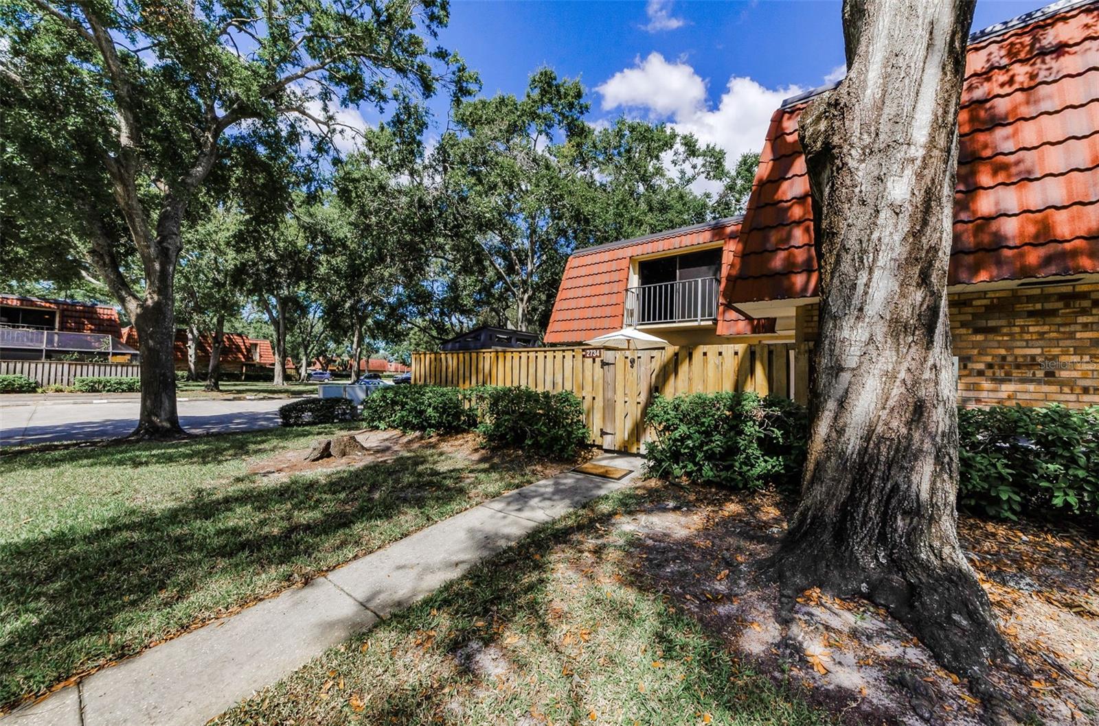 Corner Unit, surrounded by mature landscaping