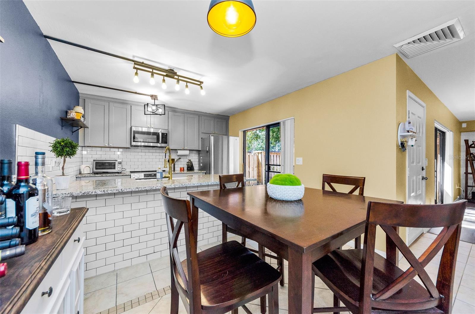 Even the Kitchen has a lovely sliding door to let in the light!