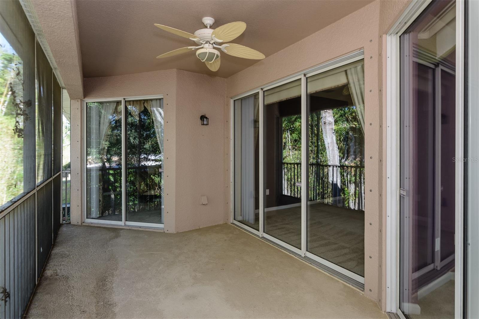 COVERED, SCREENED IN REAR PATIO WITH CONSERVATION VIEWS