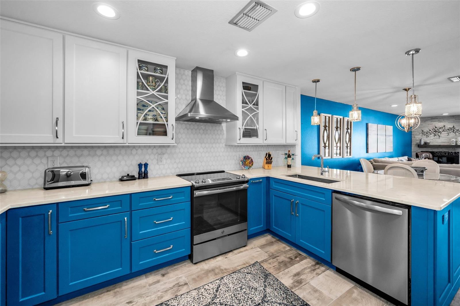 Shaker cabinets, stainless steel appliances, Quartzite Counters, Custom backsplash and More!