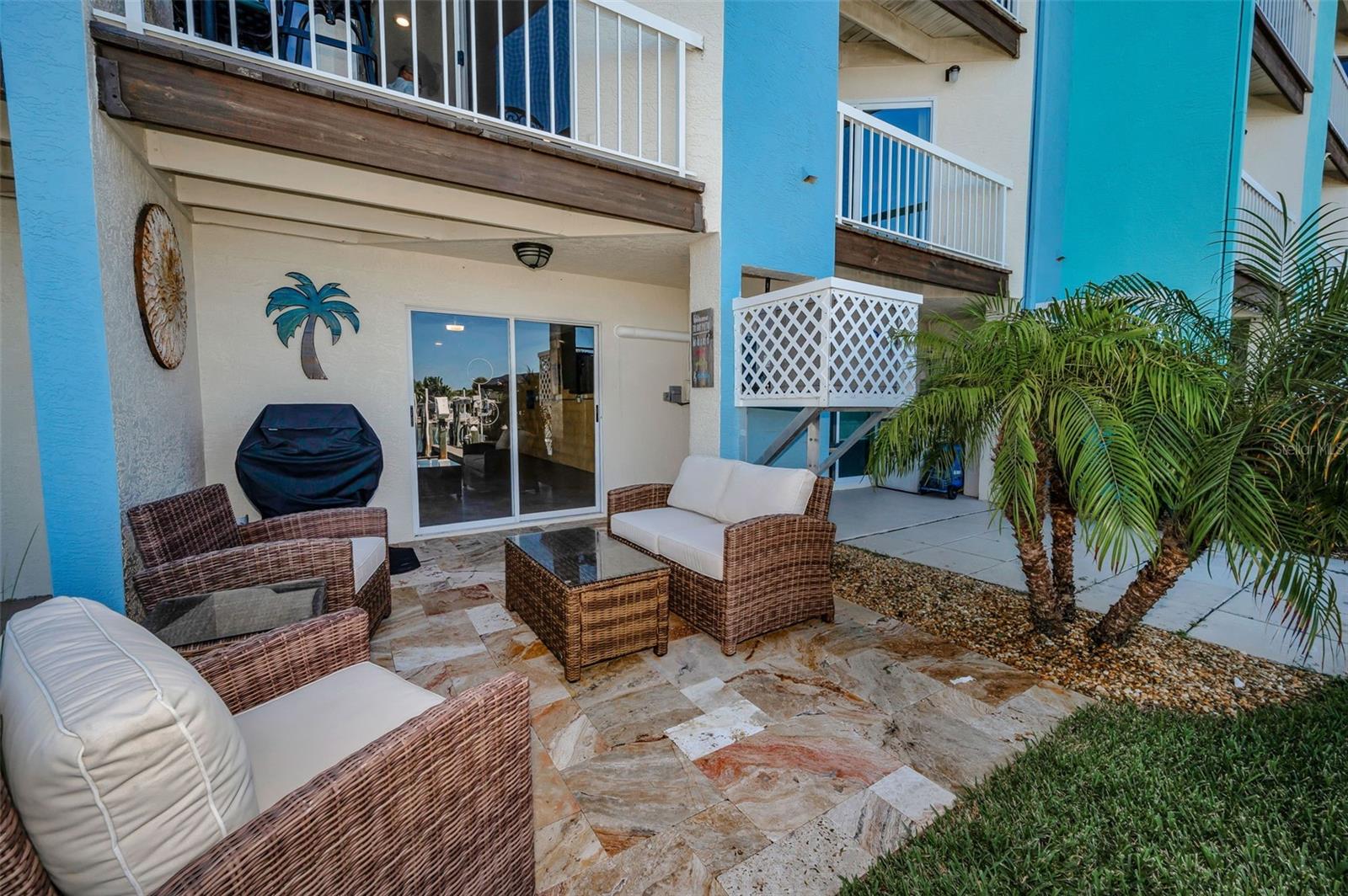 Lower level Travertine patio just outside the Garage and overlooking the Water!