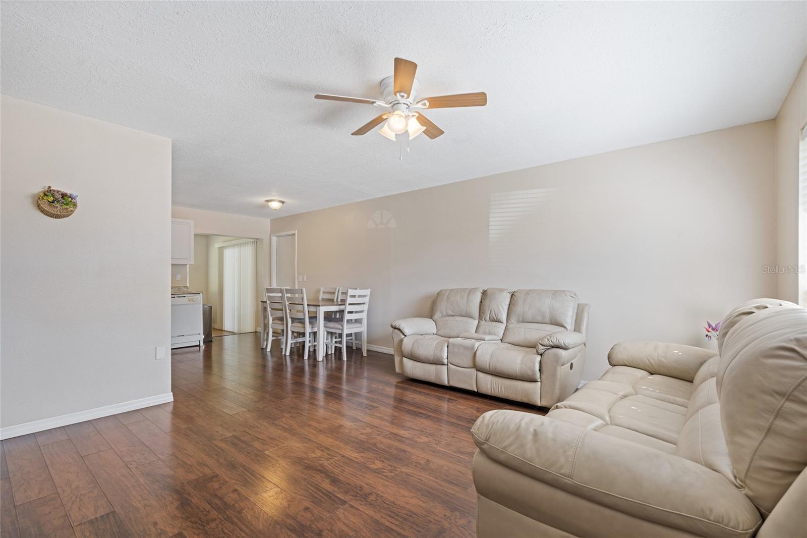 The living room flows into the eat-in kitchen.