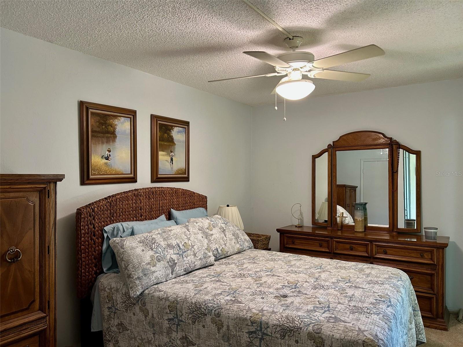 Primary Bedroom With Sliders To Florida Room