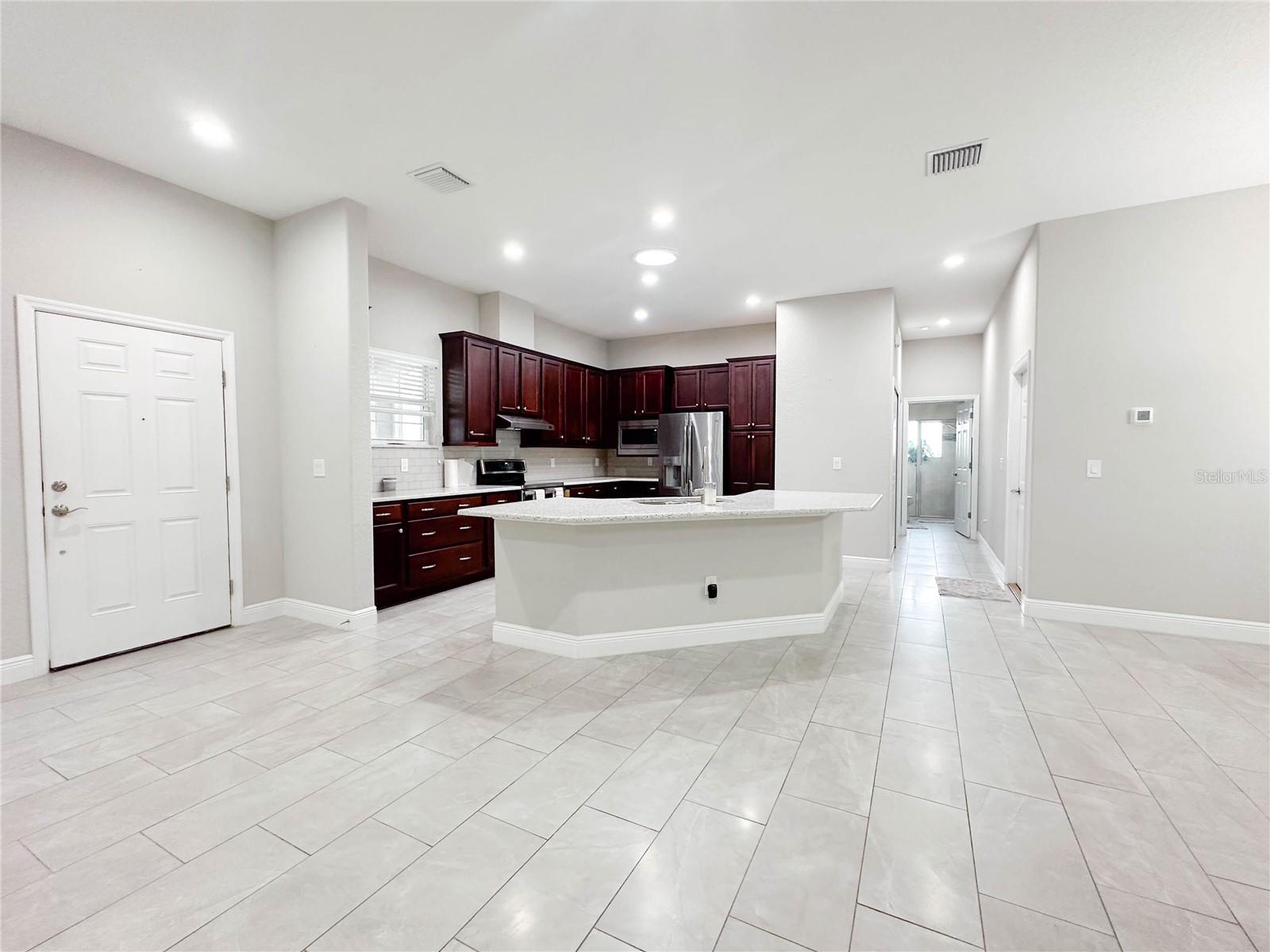 KITCHEN AND WALKWAY TO GUEST BEDROOM