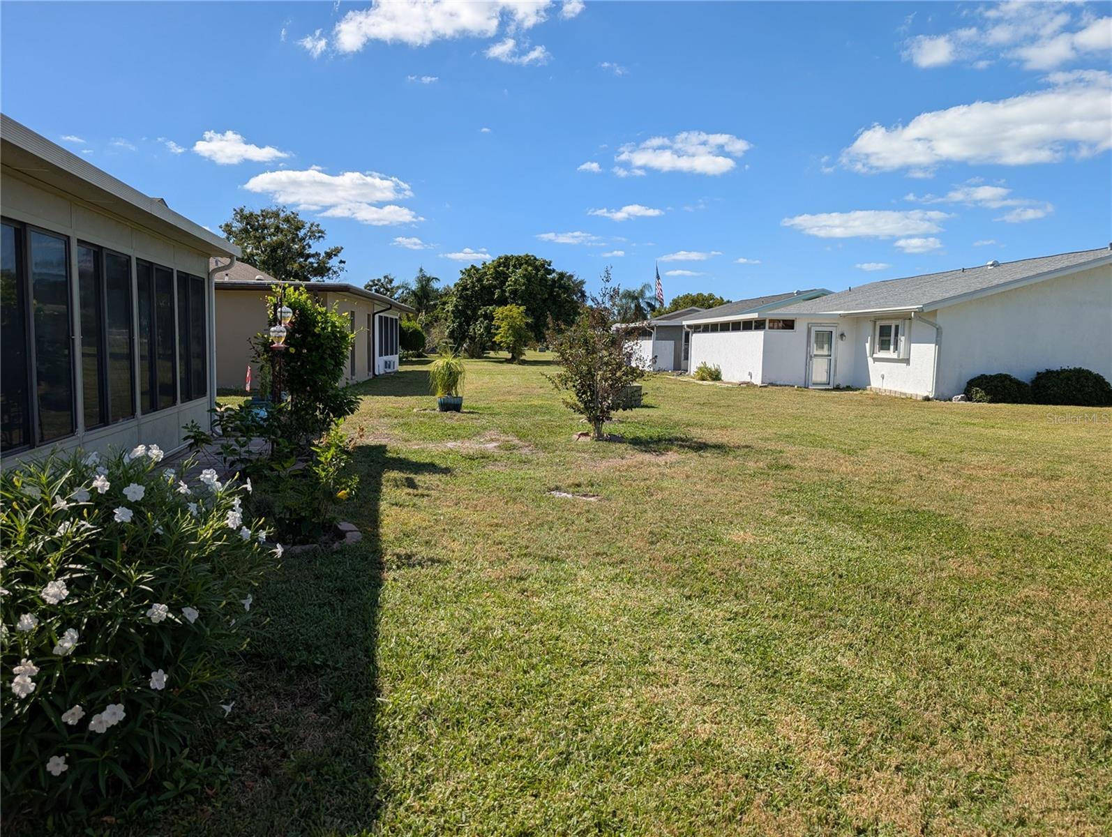 Generous space between homes provides a semi-private backyard.