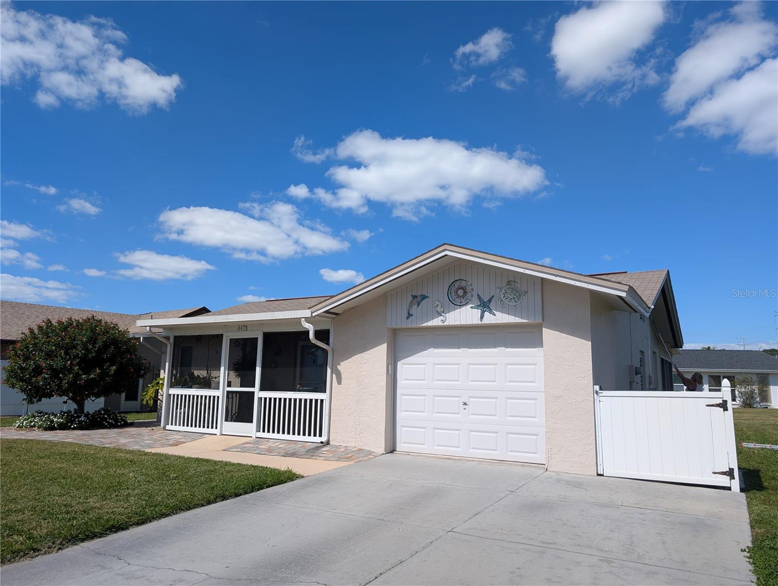 View of garage and extended driveway.