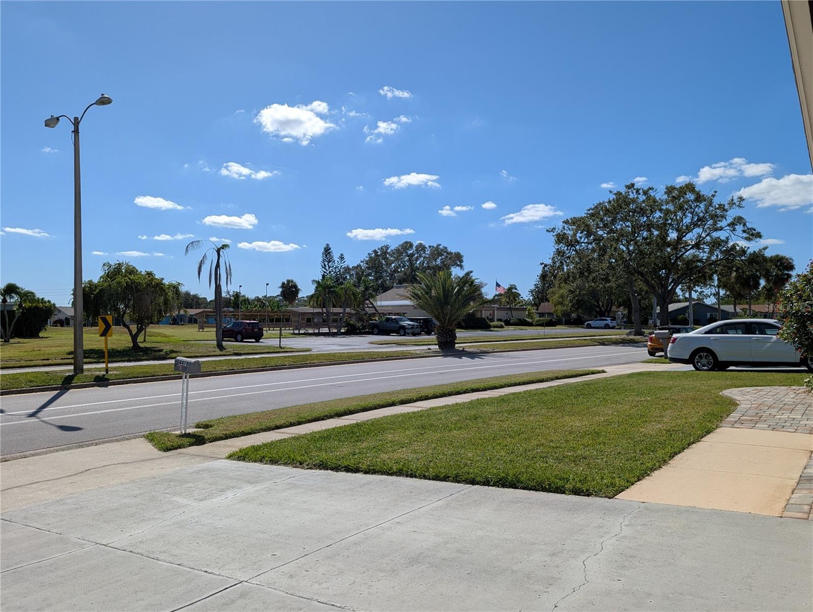 View of Clubhouse area from driveway...short distance to the pool and other amenities.